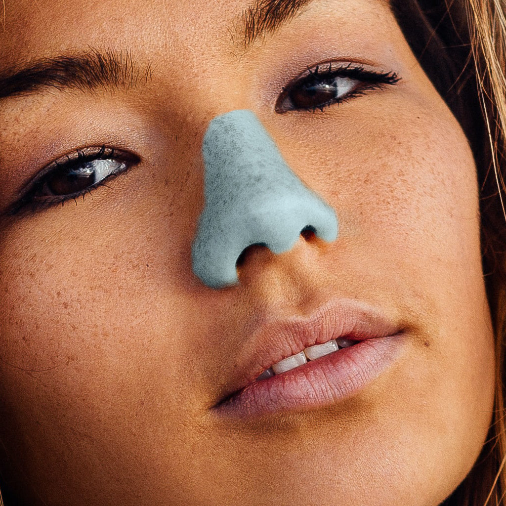 Girl with Light Blue Nöz Sunscreen showcased.